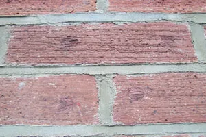 A close up of a red brick wall.